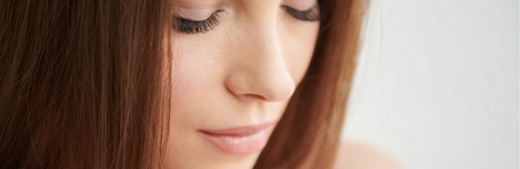 Close-up of a male model touching his jaw and lips